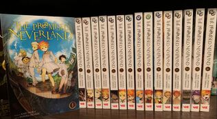 A picture showing The Promised Neverland volume 1 stacked next to volumes 2 through 16