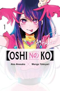 cover of Oshi no Ko volume 1. Ai is smiling with her tongue sticking out, and her hands are above her head in a pose. She has on pink gloves and her purple hair hangs around her face. There are stars in her pink eyes.