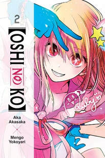 Cover of Oshi no Ko volume 2. Ruby is smiling and holding her hand above her forehead in a peace sign. She has blue gloves on. Her left eye has a white star pupil in it. She's wearing a pink dress with a pink ribbon on the collar.