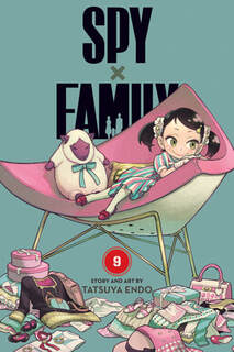 Cover of Spy x Family volume 9. Becky is in a large chair surrounded by clothing and other items.